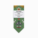 Green bandana with nature-themed designs on a white background