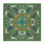 Decorative green fabric with intricate patterns of animals, insects, and flowers.