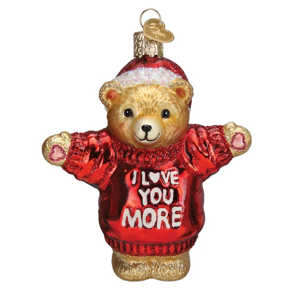 Glass bear ornament wearing a red sweater with 'I love you more' text on a white background