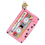 Decorative ornament shaped like a pink cassette tape with 'Peace Love & Rock n Roll Mix' text on a white background.