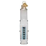 Decorative glass ornament resembling a white electronic device with blue and black buttons on a white background