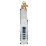 Decorative glass ornament resembling a white electronic device with blue and black buttons on a white background