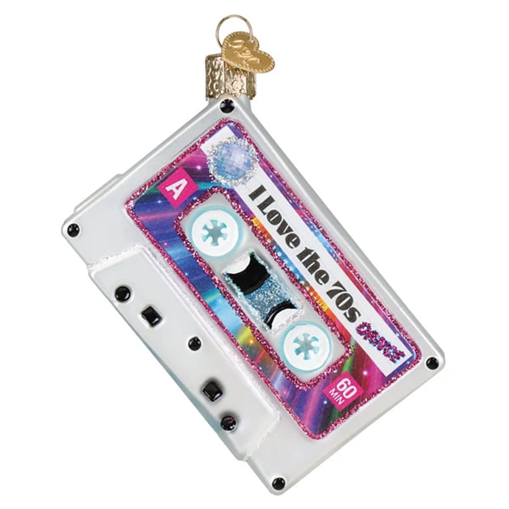A retro cassette tape ornament shaped like a clear plastic 90s cassette with a colorful holographic label reading 'I Love the 70s Best' and a gold hanging loop with a decorative key.