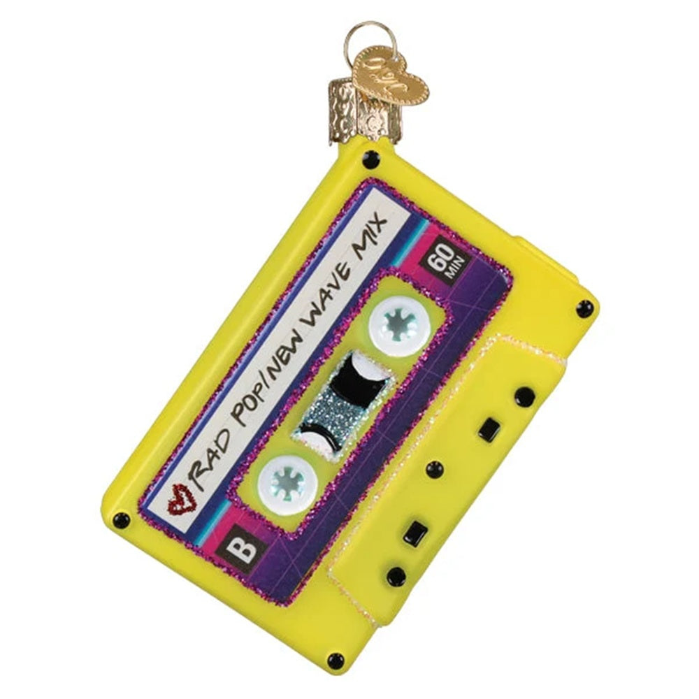 Decorative ornament shaped like a yellow cassette tape with text on a white background