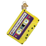 Decorative ornament shaped like a yellow cassette tape with text on a white background