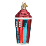 A novelty Christmas ornament shaped like a cup of iced coffee, featuring a red glittery swirl top, a red and blue striped cup with the word 'ICE' and a cartoon character, and a gold hanging loop on a white background.