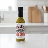 Bottle of Beehive Brothers Jalapeno Hot Sauce on a kitchen counter