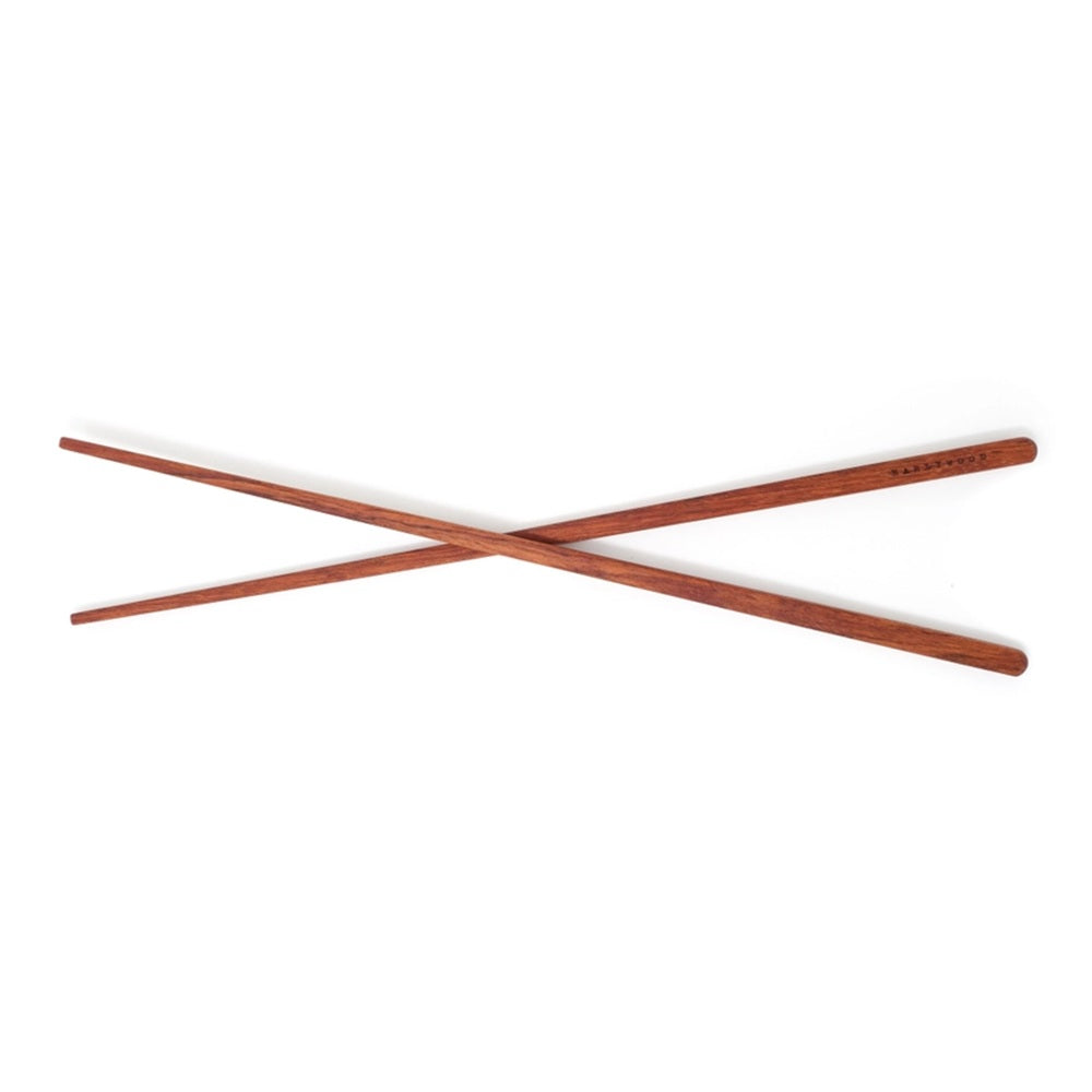 Pair of wooden chopsticks on a white background