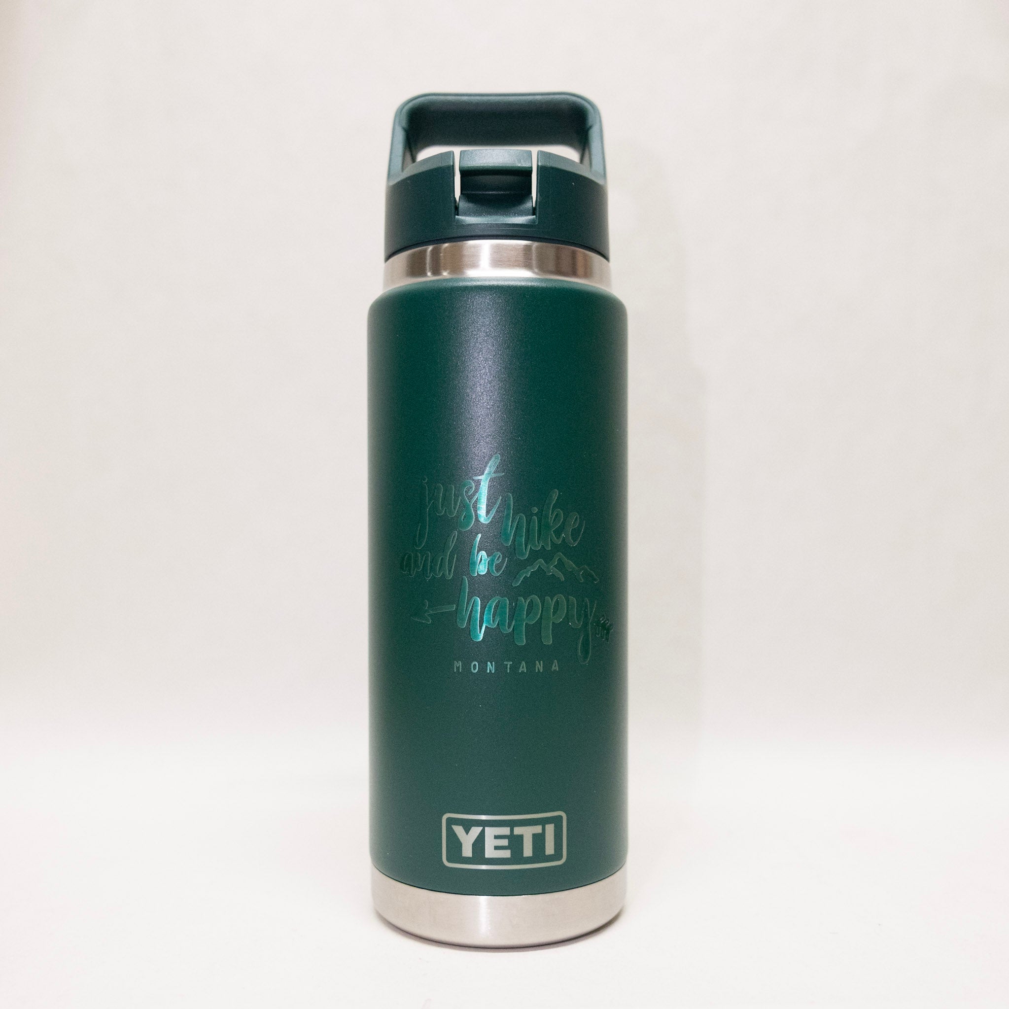 Green YETI water bottle with a motivational quote on a white background
