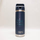 Navy blue YETI insulated bottle with 'Just hike and be happy' text on a white background