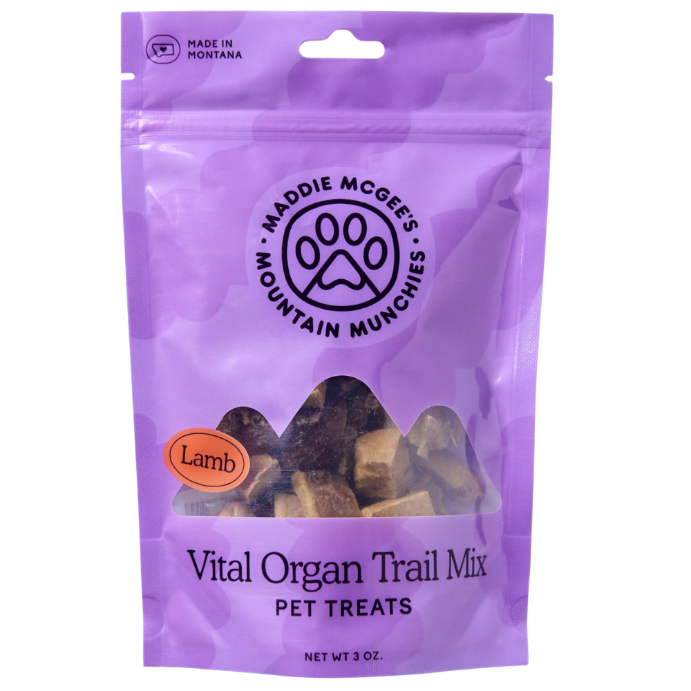 Purple package of Maddie McGee's Mountain Munchies pet treats with a paw print logo.