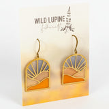 Pair of earrings on a 'Wild Lupine Folkcraft' branded card.