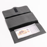 A dark gray textured leather wallet shown open on a white background, featuring a clear plastic card holder containing a buffalo-themed business card.