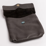 A dark brown pebbled leather pouch with a dark brown suede-like interior lining, featuring two metal snap buttons (one gold-toned, one blue-toned) and photographed on a clean white background.