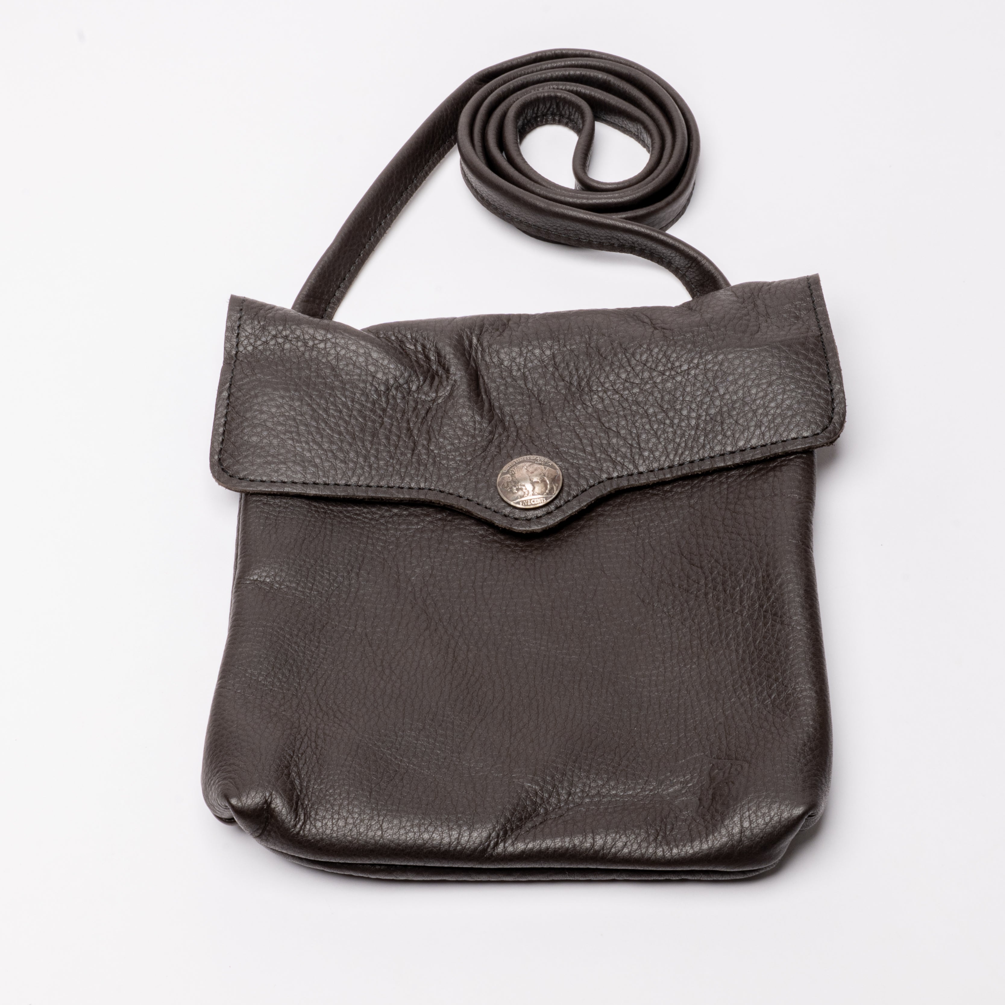 A dark brown pebbled leather crossbody bag with a flap closure and a silver-tone snap button, shown on a plain white background.
