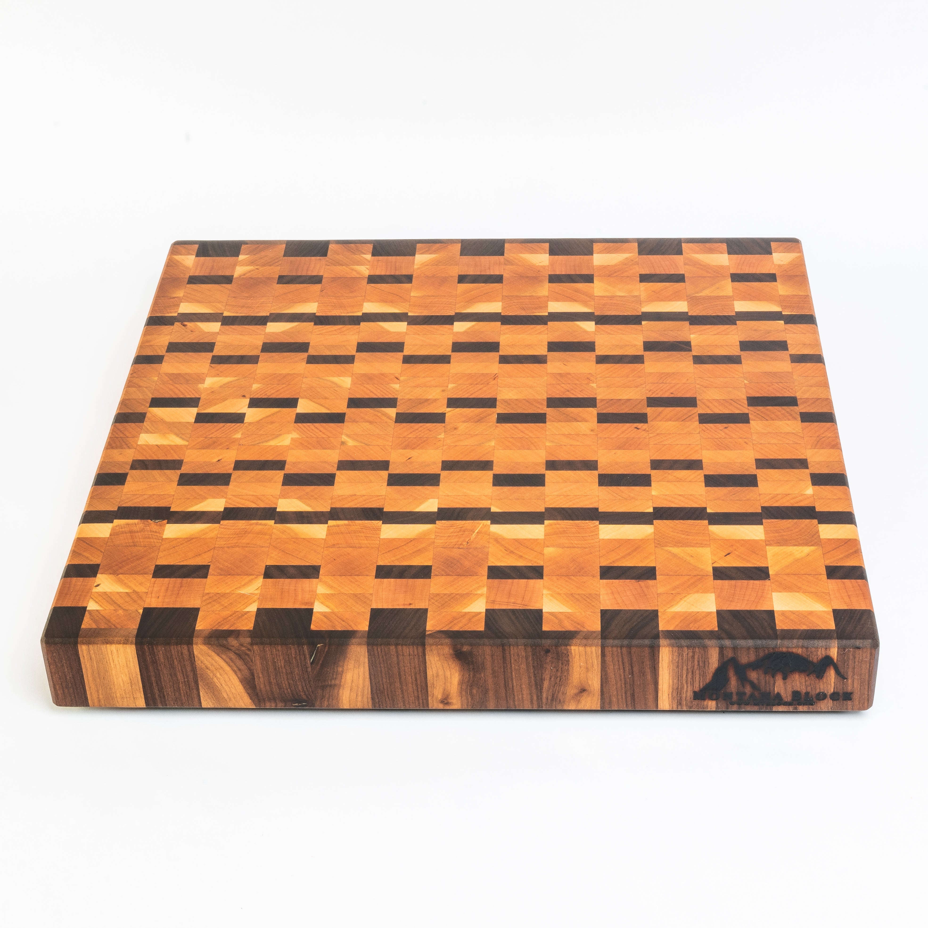 Wooden cutting board with a checkered pattern on a white background