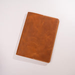 Brown leather notebook on a white background