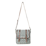 A square crossbody bag with a green and white mandala pattern, brown leather trim, and a brown shoulder strap, shown against a plain white background.
