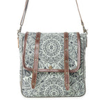 A square-shaped shoulder bag with a black and white mandala pattern on a light gray-green background, featuring brown faux-leather straps and metal studs, shown against a plain white background.