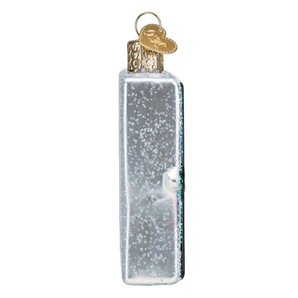 Decorative ornament shaped like a Lite-Brite with a Christmas tree design on a white background