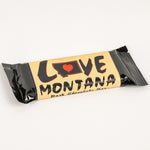 Chocolate bar with 'Love Montana' packaging on a white background