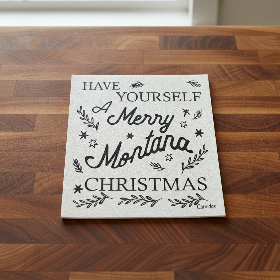 Decorative sign with text 'Have Yourself A Merry Montana Christmas' on a white background