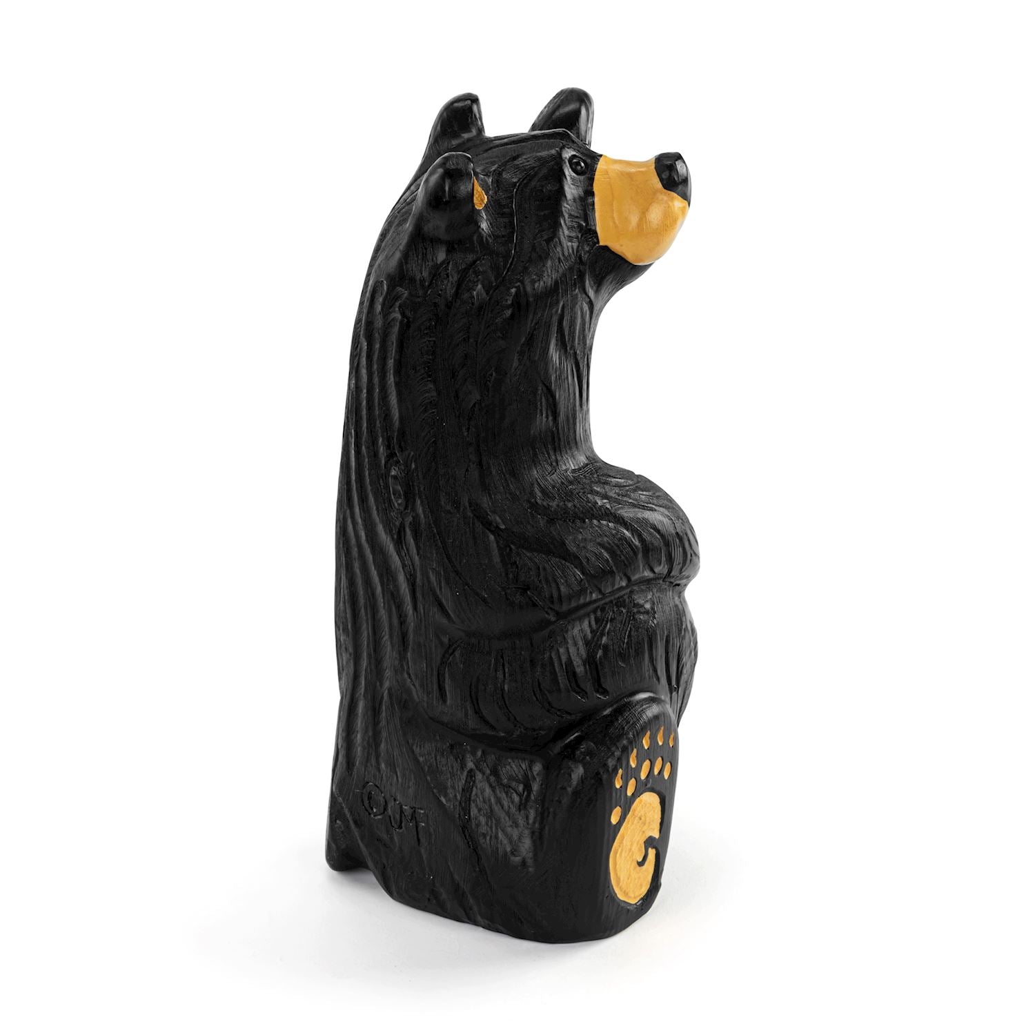 Black bear figurine with yellow accents on a white background