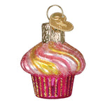 Decorative glass cupcake ornament with pink and yellow swirls on a white background