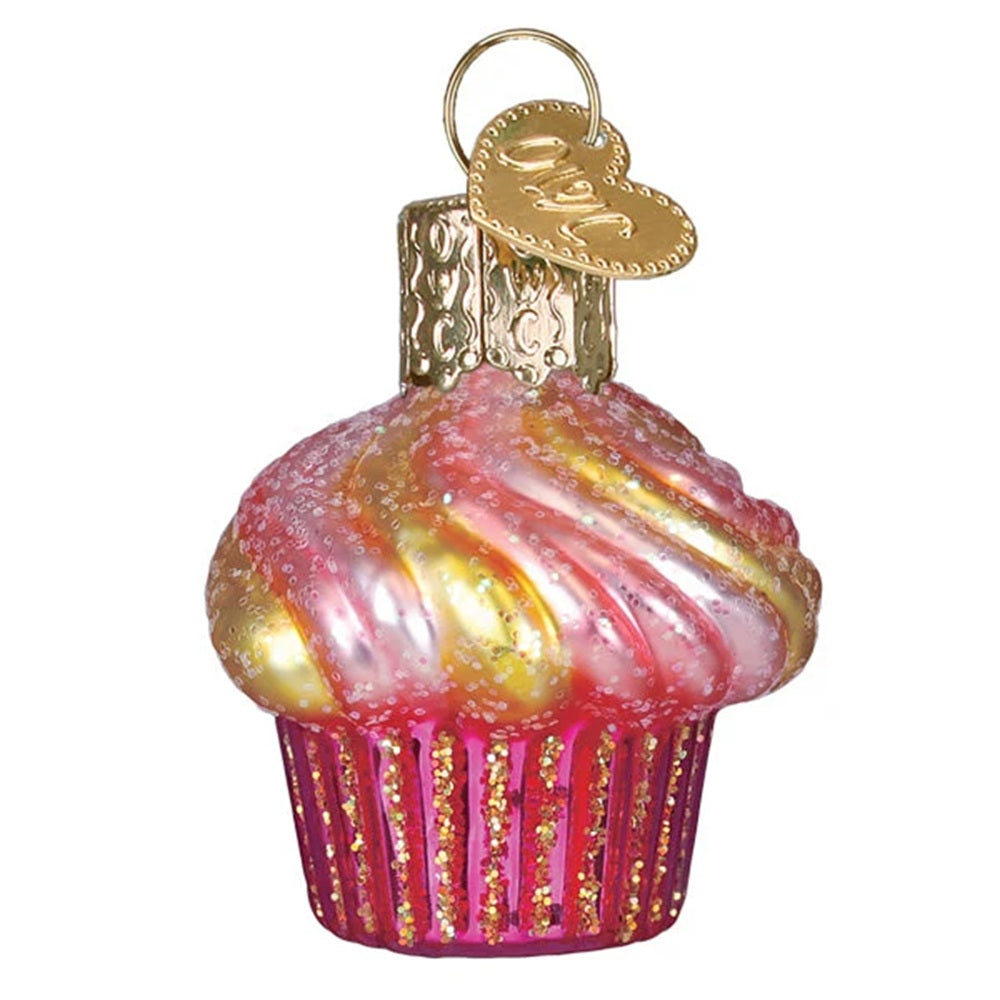 Decorative glass cupcake ornament with pink and gold swirls on a white background