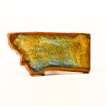 Ceramic magnet with a textured surface on a white background