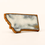 State-shaped magnet with a textured surface on a white background