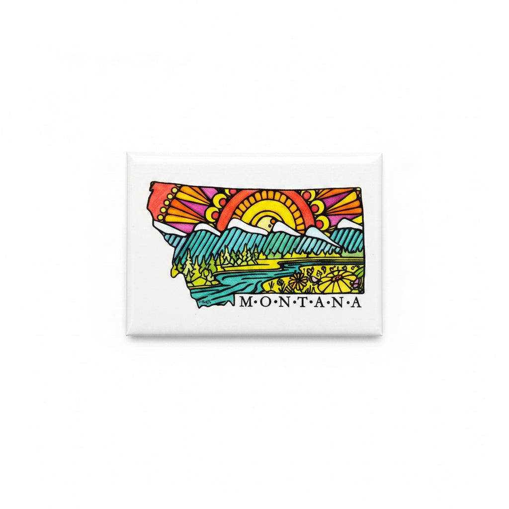 A rectangular white magnet featuring a colorful graphic of the state of Montana with a stylized sun, mountains, trees, and the word 'MONTANA' printed below, shown on a plain white background.