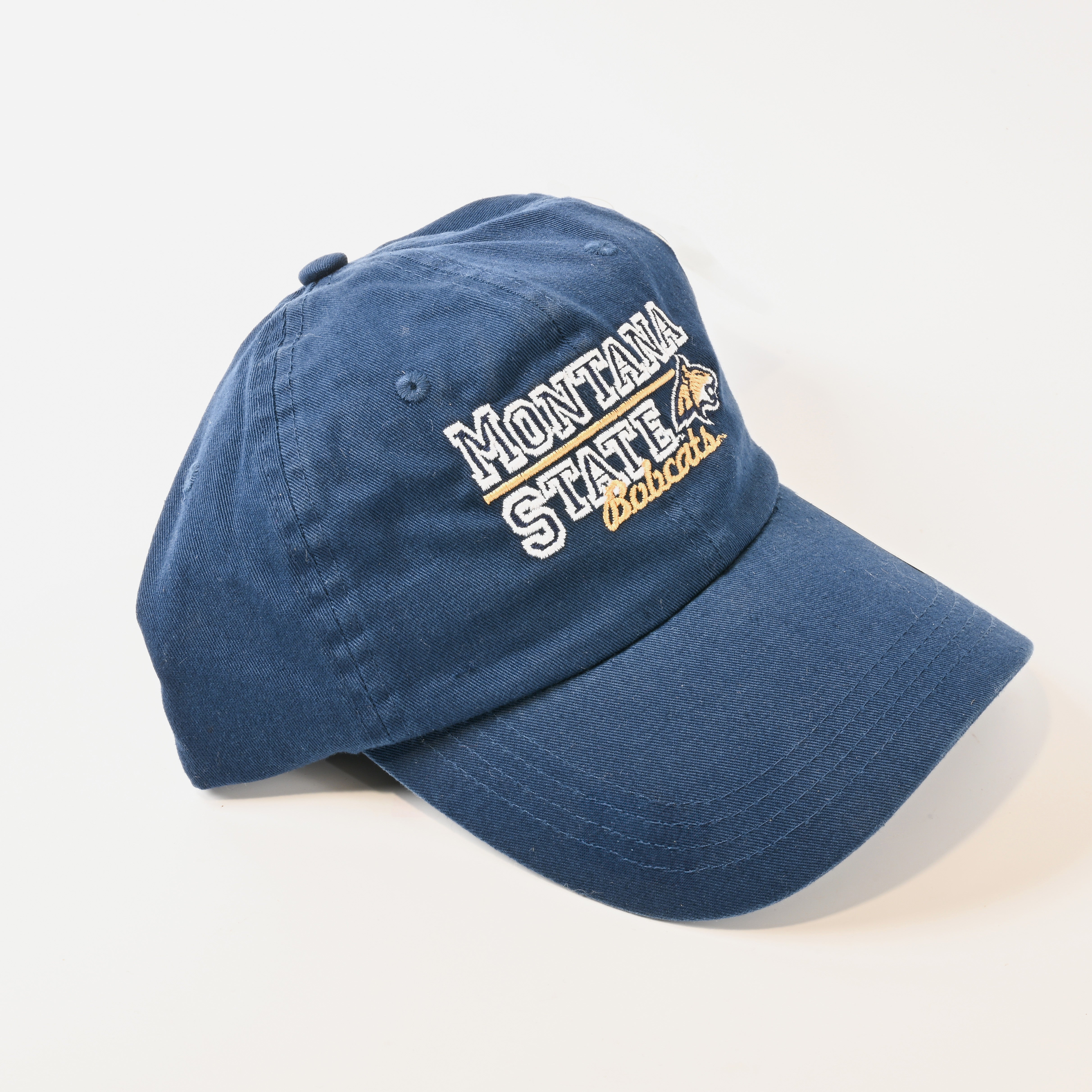 Blue cap with 'Montana State Bobcats' text on a light gray background