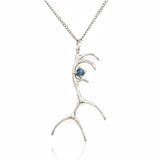 Silver antler-shaped pendant with a blue gemstone on a white background