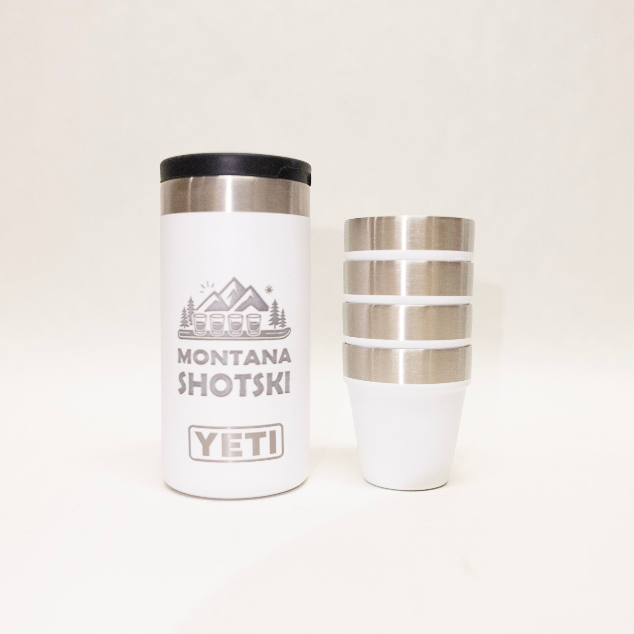 White Yeti tumbler with black lid and silver accents on a white background