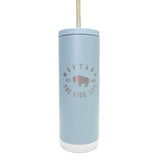 Light blue tumbler with straw featuring 'Montana The Good Life' text and logo on a white background