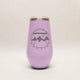 Purple tumbler with mountain design and text on a light gray background