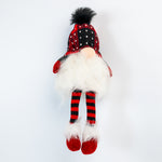 Plush gnome toy with red and black checkered hat and striped socks on a white background