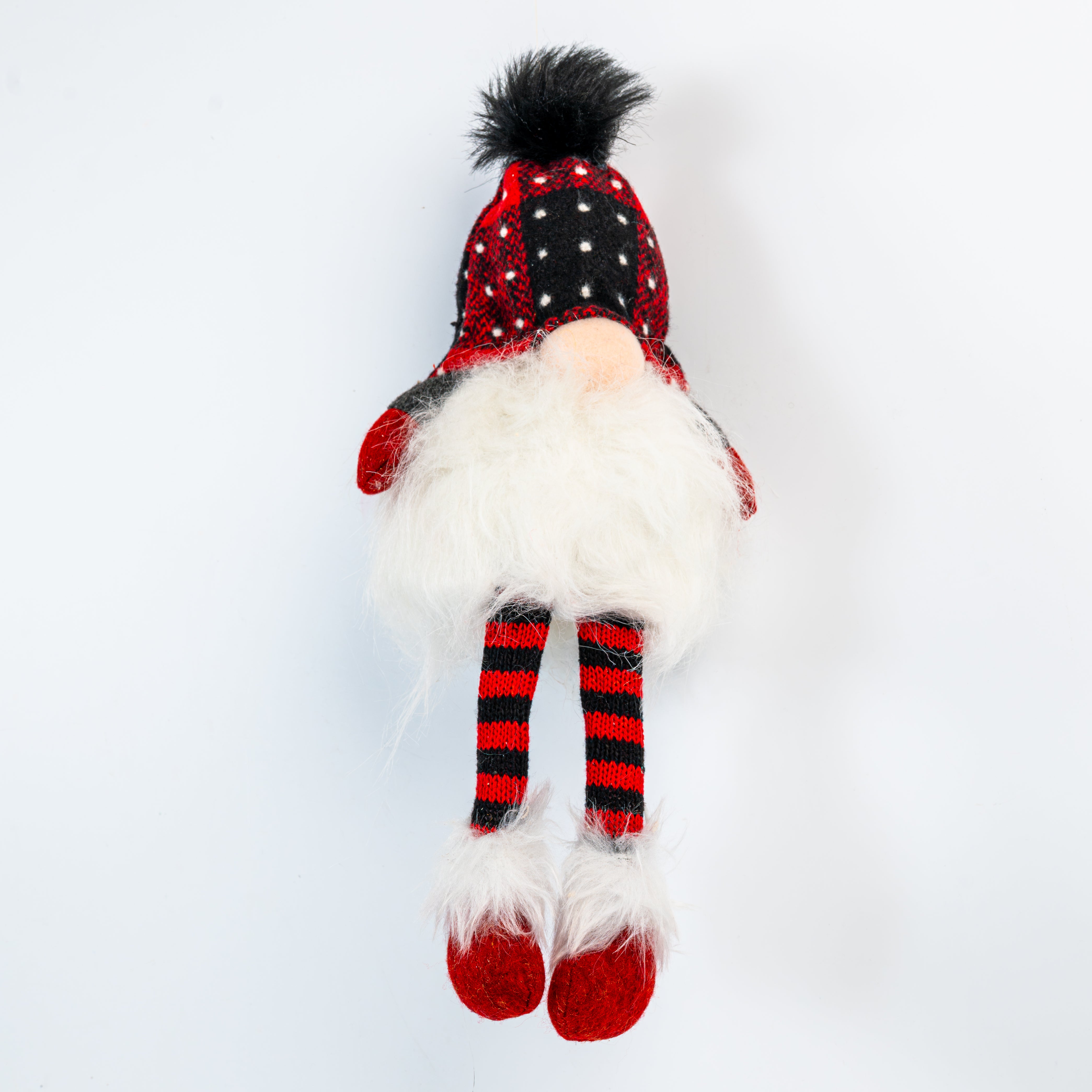 Plush gnome toy with red and black checkered hat and striped socks on a white background