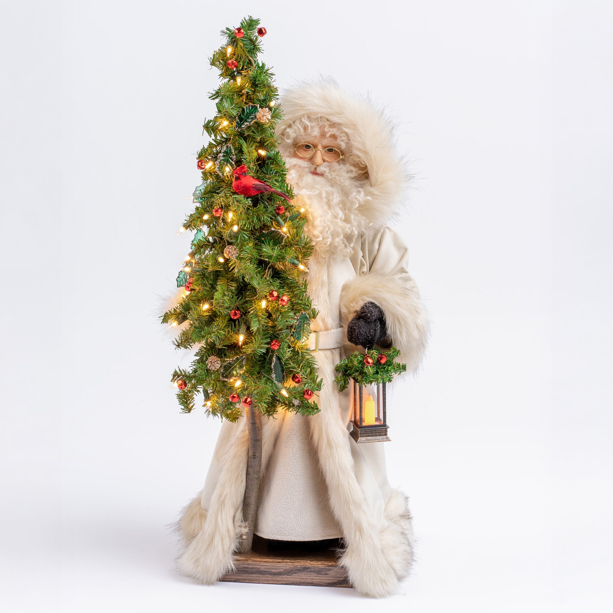 Santa Claus figure with a decorated Christmas tree on a white background