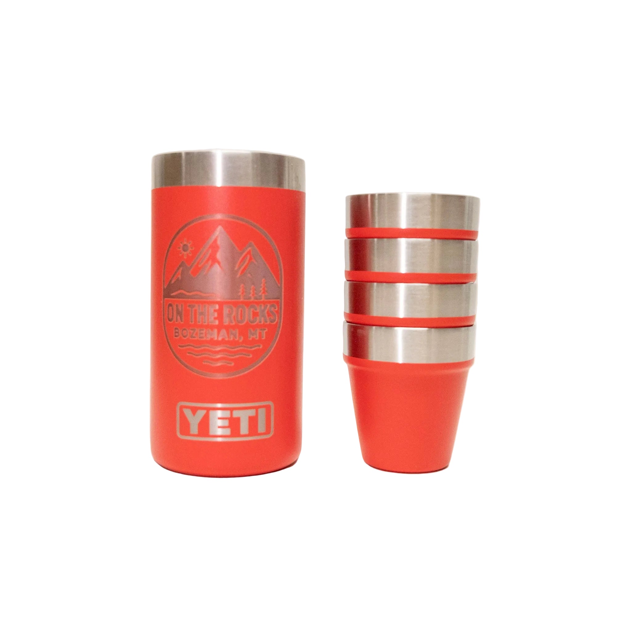 Two orange YETI tumblers on a white background