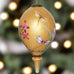 Gold is a beautiful color to add to the family Christmas tree. Whether you color coordinate your Holiday decor or not, this gold Parvaneh Flowers and Dragonflies Ornament by Inner Beauty is a stunning addition to any tree