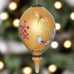 Gold is a beautiful color to add to the family Christmas tree. Whether you color coordinate your Holiday decor or not, this gold Parvaneh Flowers and Dragonflies Ornament by Inner Beauty is a stunning addition to any tree