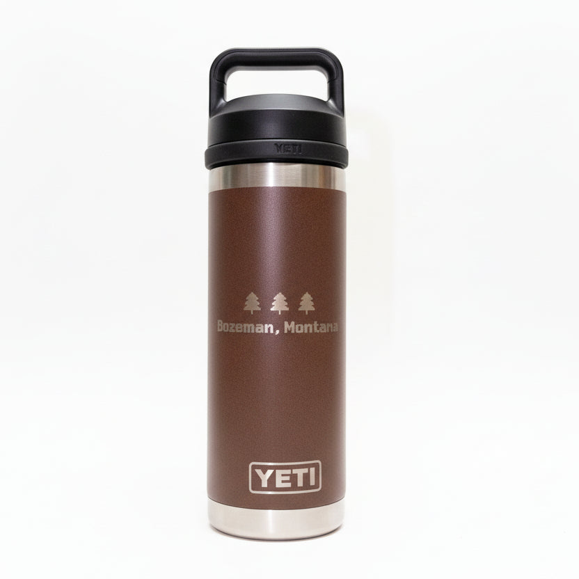 Brown YETI insulated bottle with black lid on a white background