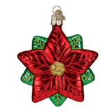 Red and green glass flower ornament on a white background