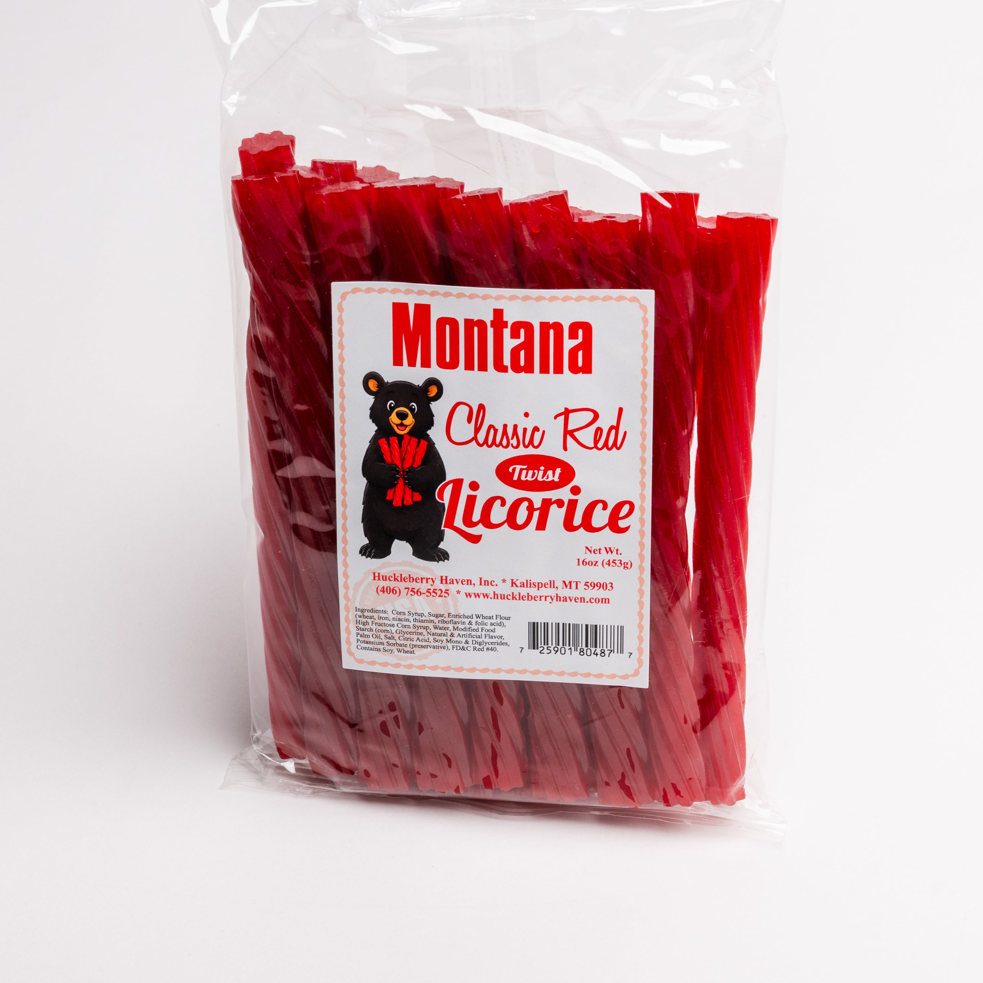 A clear plastic bag of Montana Classic Red Fossil Licorice, showing the red licorice sticks inside. The front features a white label with a black bear logo and red text.
