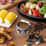 Assorted food items including corn, coffee, and roasted vegetables on a wooden surface.