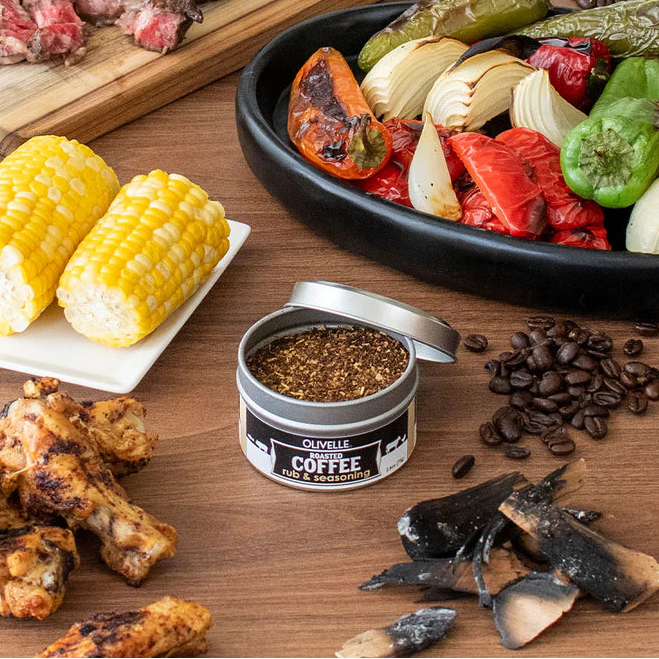 Assorted food items including corn, coffee, and roasted vegetables on a wooden surface.