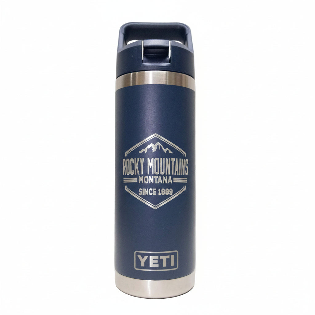 Navy YETI mug with Rocky Mountains Montana logo on a white background