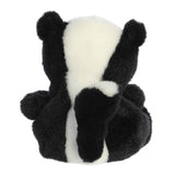 Plush toy skunk on a white background